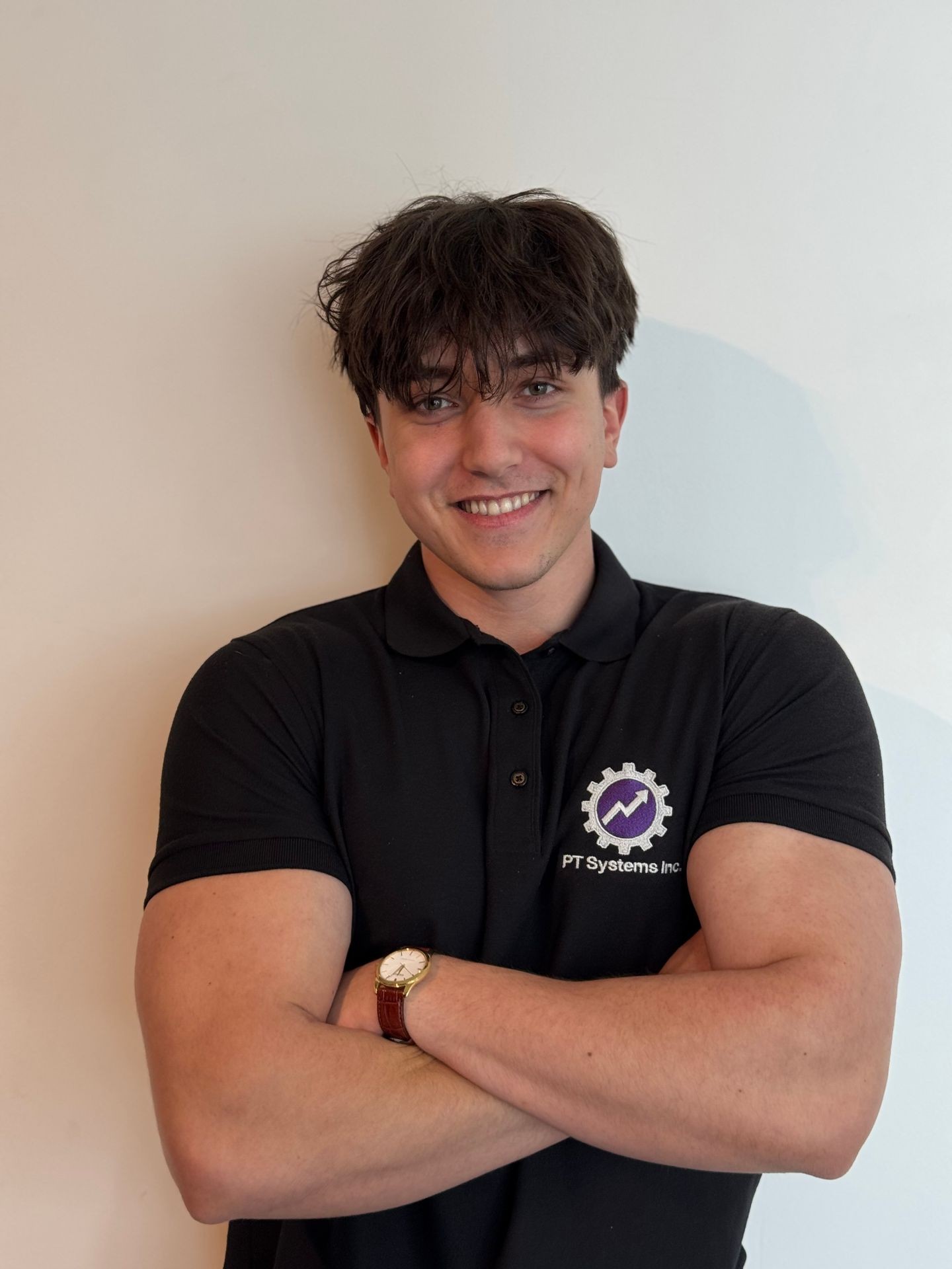 Adrian, Marketing Systems Specialist at PTSI Unicorn Gym Systems, standing confidently in casual-professional attire, specializing in gym lead generation, content marketing, and automation systems.